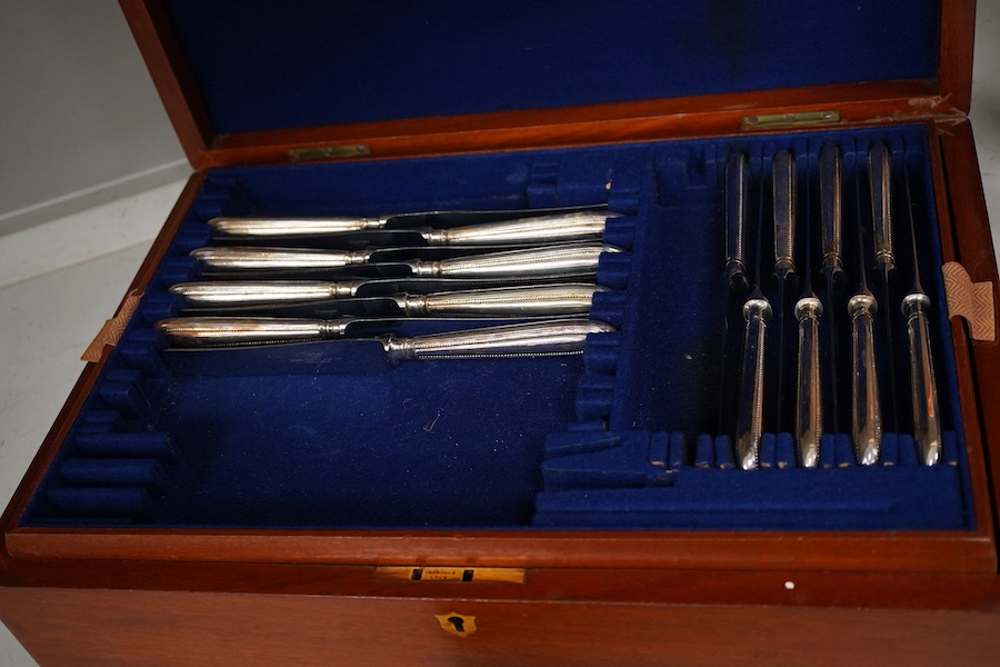 A plated bead edged part canteen of cutlery housed in two cases